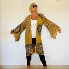 A  Beautiful Kimono Jacket. The Robe is Silk ,floaty and Sequinned ; A perfect cover up for Holidays,Festivals,Weddings and Parties. This has been Handmade from a Vintage Indian Silk Sari,so is completely Original and Sustainable. A Wonderfully Chic, flattering design in Copper and Black in a Light as air Silk Crepe . Embellished with all over Glittering Gold Sequins. This Stunning 3/4 length Jacket drapes elegantly ,with loose Kimono sleeves,and has a soft sash belt if you want to wear tied,and it is Floaty and Comfortable to wear. One Size S M L XL Will flatter any UK size 10 to 18 , US 6 to 14 ,  EU 38 to 44. The length is 110 cm / 43 " . The chest is 108 cm / 43 " . This Beautiful unique jacket will soon become your Favourite Go To in your wardrobe . Timeless Boho Chic ! To see more un Loose Kimono, Beaded Cardigan, Unique Jackets, Etsy Boutique, Embellished Jacket, Beautiful Kimonos, Silk Kimono, Kimono Sleeve, Kimono Jacket