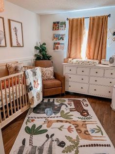 a baby's room with an elephant rug and crib