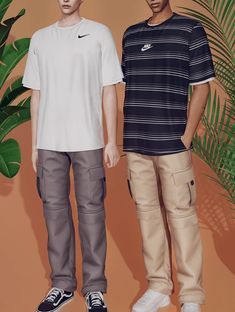 two young men standing next to each other in front of a palm tree and potted plant