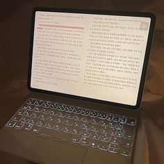 an open laptop computer sitting on top of a table