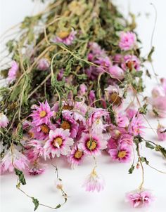 pink and white flowers laying on top of each other