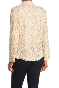 Perfect for your upcoming Zoom meetings, this tonal embroidered lace blazer jacket adds refined styling to your weekly rotation. Spread collar. Long sleeves. Front button closure. Tonal embroidered construction. Lined. Approx. 25" length. Imported Formal Long Sleeve Lace Top For Fall, Elegant Spring Outerwear With Lace Trim, Fall Formal Lace Outerwear, Elegant Lace Trim Outerwear For Spring, Formal Lace Outerwear For Fall, Chic Long Sleeve Blazer With Floral Embroidery, Spring Lace Top For Workwear, Chic Lace Top For Spring Formal Occasions, Long Sleeve Lace Top For Spring Wedding