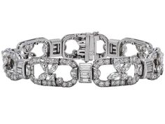 Art Deco Diamond Bracelet in Platinum   Composed of seven oval links set with old full-cut round diamonds, each link with single a floral motif with marquise-cut diamond petals and square step-cut diamond stem, the baguette-cut diamond links flanked by two half-moon shaped diamonds, in platinum. Jewellery Marketing, Marquise Cut Diamond, Baguette Cut Diamond, Moon Shapes, Art Deco Diamond, Art Deco Jewelry, Half Moon, Art Deco Fashion, Floral Motif