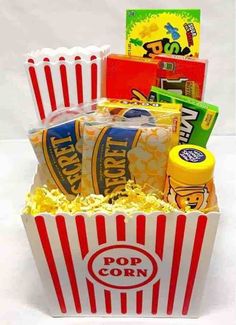 the popcorn box is filled with snacks and condiments to make it look like they are