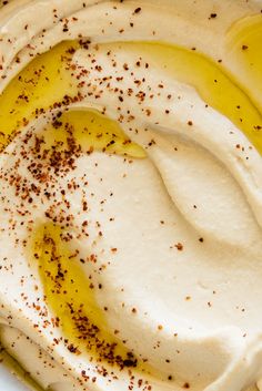 a white plate topped with whipped cream and brown sprinkles