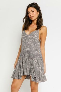 A perfect day starts with the Swing By Silver and Mauve Boho Print Sleeveless Mini Dress! Lightweight rayon fabric, with a silver grey, and mauve boho print throughout, shapes adjustable spaghetti straps, a V-neckline, and a fitted bodice. A zigzagging drop waist tops the flaring skirt before it falls to a mini hem. Lined. DETAILS & CARE Rayon. Machine Wash Cold. Imported. Day Mini Dress, Boho Beach Outfit, Grey Lace, Boho Mini Dress, The Swing, Pink Boho, A Perfect Day, Boho Print, Sleeveless Mini Dress