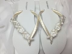 These beautiful white flip flops are wrapped with ivory satin ribbon, and adorned with a ivory  Bridal flower trim with seed bead and sequins. Ribbon color is ivory  if you are needing other colors of ribbon or decoration please contact me and will be happy to accommodate you! All flip flops are handmade to order and the production time is 3 to 5 days, then please allow additional time for shipping. Amazing for beach, weddings, flower girl or a fancy event, you choose! Please choose your size fr Adjustable White Flip Flops For Wedding, White Adjustable Flip Flops For Wedding, White Open Toe Flip Flops For Wedding, Silver Bridal Sandals, Beach Wedding Flip Flops, Flip Flops Wedding, Bridesmaid Flip Flops, Bridesmaid Sandals, Reception Shoes