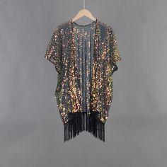 Welcome to my shop, I am in China. It will need around 30 days for international orders. Please consider the time when placing order. Sequin bohemian kimono,perfect for a casual day out. Material: mesh, sequins Body width available S: 27.5 inches(70cm), circle 55 inches(150cm) M: 31.5 inches(80cm), circle 63 inches(160cm) L: 35.5 inches(90cm), circle 71 inches(180cm) Body length available Short:33.5 inches (85cm) include tassels Long: 43.3 inches (110cm) include tassels CARE: Wash gently by hand in cold water.  Single wash. Don't press! Hang to dry.  Maybe you will like other items in my shop, find them here: https://www.etsy.com/shop/twogirlstudio Spring Party Kimono With Open Front, Spring Party Open Front Kimono, Black Summer Party Kimono, Bohemian Open Front Kimono For Party, Long Black Party Kimono, Bohemian Kimono For Summer Party, Bohemian Summer Party Kimono, Black Long Kimono For Party, Summer Party Bohemian Kimono