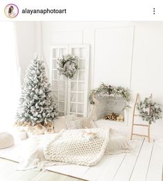 a white room decorated for christmas with wreaths on the windowsill and other decorations