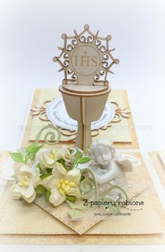 a close up of a card with flowers and an elephant on it's stand