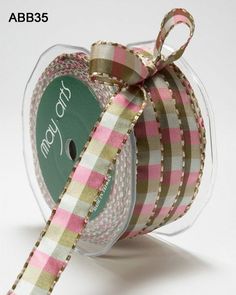 a spool of pink and gold plaid ribbon