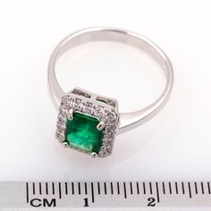 Handmade ring with high jewelry finish. 750 white gold ring hallmarked, with green emerald surrounded by diamonds. Weight: 4.26 grams. Head size: 11.1 x 9.48 mm. Ring size*: 17.8 mm or 7 3/4 (US). * We adjust the size if you need it for free, consult us. Natural emerald of 1.35 ct. Cut: emerald. Color: intense green. Clarity: transparent with small inclusions. 18 diamonds of 0.02 ct. Total: 0.36 ct. Cut: brilliant. Color: F-G. Clarity: VS1-VS2. Shipped with UPS or Fedex, accompanied by a certifi White Gold Emerald-cut Ring With Pave Setting, Silver Emerald Cut Ring With Pave Setting, Silver Emerald Ring With Pave Setting, Emerald Gem, Emerald Color, Bluish Green, White Gold Ring, Green Emerald, Multi Stone Ring