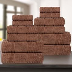 several brown towels stacked on top of each other