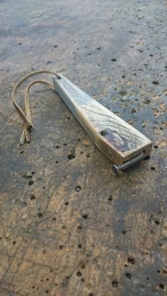 a wooden object laying on the ground