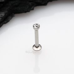 This Basic Gem Ball Top Threadless Push-In Steel Labret is all you need to rock your style with a sparkle that's sure to make tongues wag! No poking or prodding required - it's a push-in job! * Material: 316L Stainless Steel * Available in many different size configurations.  Please choose accordingly * Example: 20GA, 6mm, Gem 2mm  20 Gauge, 6mm Post length, 2mm Gem Ball Size. * Simply push it in. Enjoy our threadless body jewelry * This item is NOT compatible with our OneFit Threadless Line of Piercings Cheek, Piercings Facial, Vertical Labret, Piercings Cartilage, Lip Piercings, Heavy Sweating, Ear Piercings Cartilage, Facial Piercings, Snake Bites