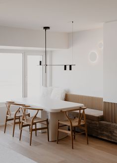 a white table and chairs in a room