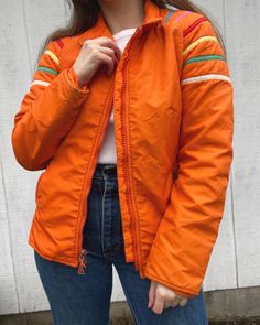 The prettiest vintage 80's puffer jacket! Who doesn't love this color combo right?! Some wear and the clip on the zipper is broken but doesn't effect actual wear. USA made.  . Fits small to medium best  . Measurements: Pit-Pit - 18 1/2" Length - 25" Retro Spring Outerwear With Zipper Closure, Vintage Nylon Windbreaker For Spring, Retro Nylon Windbreaker For Fall, 90s Style Nylon Spring Outerwear, Vintage Spring Outerwear With Zipper Closure, Retro Nylon Winter Outerwear, Retro Winter Nylon Outerwear, Vintage Nylon Outerwear For Fall, Retro Orange Winter Outerwear