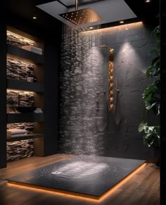 a bathroom with a large shower head and lights on the wall, along with wooden flooring