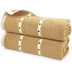 two towels folded on top of each other with brown and white polka dot trims