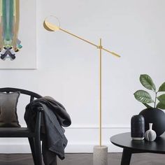 a living room scene with focus on the floor lamp