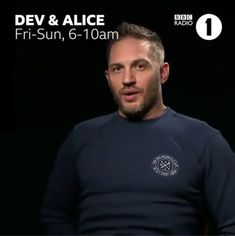 a man in a blue shirt is talking to someone on the radio with an ad for dev & alice