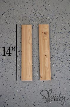 two pieces of wood sitting on top of a floor next to a ruler with measurements for each piece