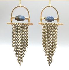 'Elegant' meets 'edgy' in these limited edition hammered arc fringe earrings.  Accented with gorgeous, faceted pietersite or blue kyanite, these unique beauties hang about 3" long and will turn heads for sure :)  Hand-formed hammered brass with antiqued brass chain fringe and the gemstone of your choice.   Choose between pietersite and kyanite:Pietersite is a truly magical & mysterious crystal; a variety of quartz composed [naturally] of a swirling mix of tiger's eye, hawk's eye, and jasper. Gold Fringe Earrings In Brass, Bohemian Brass Fringe Earrings, Metal Fringe Dangle Earrings, Fringe Dangle Metal Earrings, Fringe Dangle Chandelier Earrings, Artisan Metal Chandelier Earrings With Dangle Shape, Artisan Gold Jewelry With Fringe, Hammered Metal Chandelier Earrings, Artisan Fringe Drop Earrings