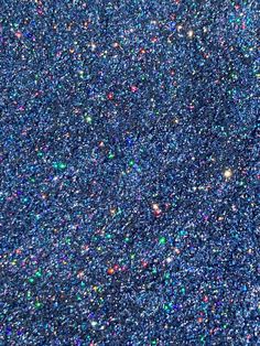 the sky is filled with lots of tiny stars and sparkles in blue, green, pink, yellow, purple