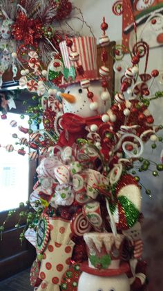 a christmas tree decorated with candy canes and snowmen