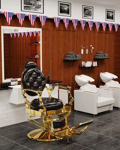 a barbershop with chairs and american flags on the wall behind it, in front of two mirrors