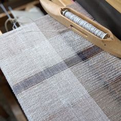 the weaving machine is being used to weave fabric