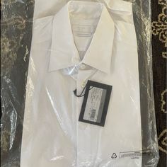 Size 40-15 3/4 White In Original Plastic Packaging Luxury Fitted Shirt For Daywear, Luxury Fitted Daywear Shirt, Designer Fitted Shirt For Daywear, Designer Fitted White Dress Shirt, Designer White Dress Shirt For Semi-formal Occasions, Luxury Fitted Dress Shirt, Fitted Short Sleeve Dress Shirt For Daywear, Prada Shirt, Long Sleeve Striped Dress