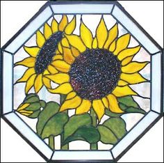 a stained glass sunflower is shown in the center of a hexagonal window