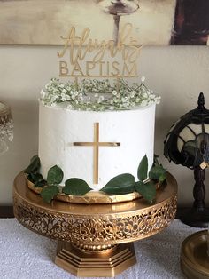 a cake with flowers and a cross on top