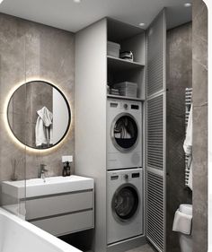 a washer and dryer in a modern bathroom