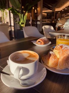 a cup of coffee and some pastries on a table