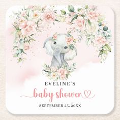 a baby shower sign with an elephant surrounded by pink flowers and greenery on a white background