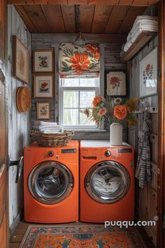 an orange washer and dryer in a small room with wood paneling on the walls