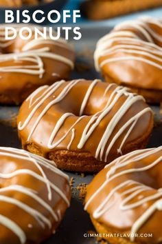 chocolate covered doughnuts with white icing on a baking sheet, ready to be eaten