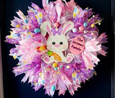 a wreath that has a bunny on it with the words the gummy family written on it