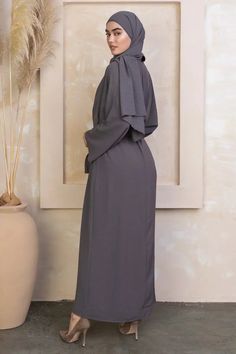 The Four Piece Kimono Abaya Set is sophisticated and graceful! Featuring high quality breathable fabric. This abaya includes the inner sleeveless dress, open abaya, hijab and luxurious belt. You will be looking for an excuse to wear this beautiful abaya. Fabric Belt and Hijab Included Model is 5'10" and wearing size M Open Front Maternity Friendly Nursing Friendly Wudu Friendly Abaya Fabric, Ceremonial Clothing, Abaya Hijab, Abaya Kimono, Dress Kimono, Open Abaya, Swimsuits Outfits, Maxi Cardigan, Nursing Friendly