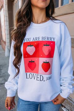 Show your love for someone special with our playful You Are Berry Loved Crewneck in white. Perfect for Valentine's Day, this crewneck will keep you warm and stylish while sending a sweet message. Liz is 5'3" and wearing a size medium. 50% Cotton, 50% Polyester Design printed on a Gildan sweatshirt For best care: wash inside out on delicate, hang dry Glitter Flask, The Republic Of Tea, Tyler Candle Company, Fawn Design, Sweet Message, Gildan Sweatshirt, Diff Eyewear, Dear John, Sweet Messages