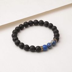 Benefits The Blue Regalite Himalayan Stone Bracelet includes both Lava Stone beads and Blue Regalite beads. Blue Regalite is a grounding, strengthening stone that promotes stability, clarity, and inner-peace, making it ideal for encouraging compassion, contentment, and tranquility. The lava stone also known as “basalt” is a porous volcanic rock that has been solidified from molten lava after conditions of intense heat and pressure. Materials We carefully design, test and ensure the quality of ou Molten Lava, Diffuser Jewelry, Volcanic Rock, Diffuser Bracelets, Natural Stone Bracelets, Lava Bead, Leather Handbags Tote, Lava Stone, Blue Bracelet