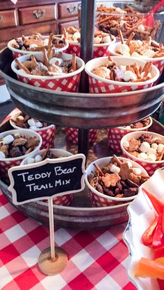 a table topped with lots of pies covered in toppings