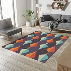 a modern living room with an abstract rug on the floor