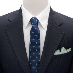 Rich navy blue forms the background canvas for this 100% silk tie. Featuring a series of Yoda images and small green dots reminiscent of stars sprinkled across a galaxy, this bestselling tie has become one our firm fan favorites. Wear alone or pair with one of our matching Yoda tie bars for a complete formal look. Officially licensed by Lucasfilm LTD. Green Formal Tie With Pocket Square, Dapper Green Ties For Business, Green Dapper Business Ties, Green Dapper Ties For Business, Yoda Images, Tie Box, Sock Storage, Star Sprinkles, Magic Wallet