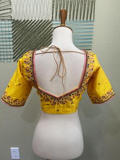 ❥ Handmade Designer stitched blouse ; Can be used for sarees / Lehengas. ❥ Ready to ship (Price mentioned is for Size 34-38)  ❀❀ Return / Exchange Policy :  ※ No Return/ No Exchange / No Cancellation! ※We need proof of video while package is opening for considering any case of missing or damaged products ;  ※ We can not accept any returns , if video at the time of package opening is not provided by the client . ღ ღ Please be courteous and don't ask for negotiation on prices ! We define prices ba Dola Silk Bollywood Blouse For Transitional Seasons, Unstitched Yellow Blouse For Navratri, Bollywood Style Designer Tops With Traditional Drape, Bollywood Designer Wear Tops With Traditional Drape, Transitional Semi-stitched Yellow Blouse, Yellow Unstitched Blouse With Cutdana Details, Unstitched Bollywood Style Dola Silk Blouse, Transitional Dola Silk Saree Blouse, Multicolor Bollywood Blouse For Wedding