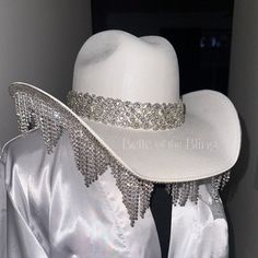 a white hat with silver sequins on it