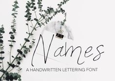 the name names is written on a piece of paper next to some flowers and an envelope