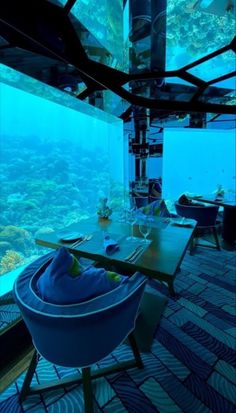 an underwater restaurant with tables and chairs